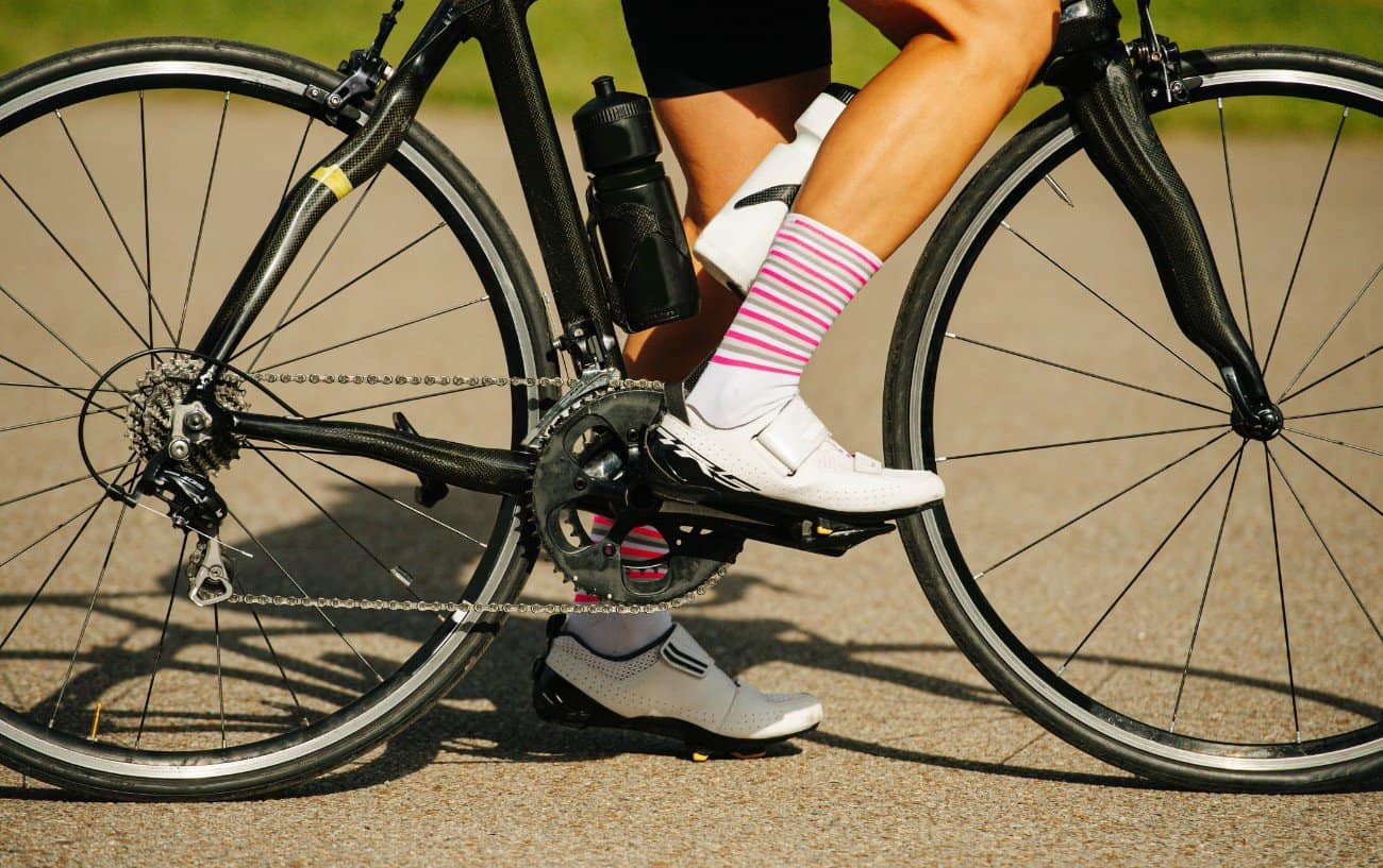 Close-up of a bike's crankset, showing the crank arms.