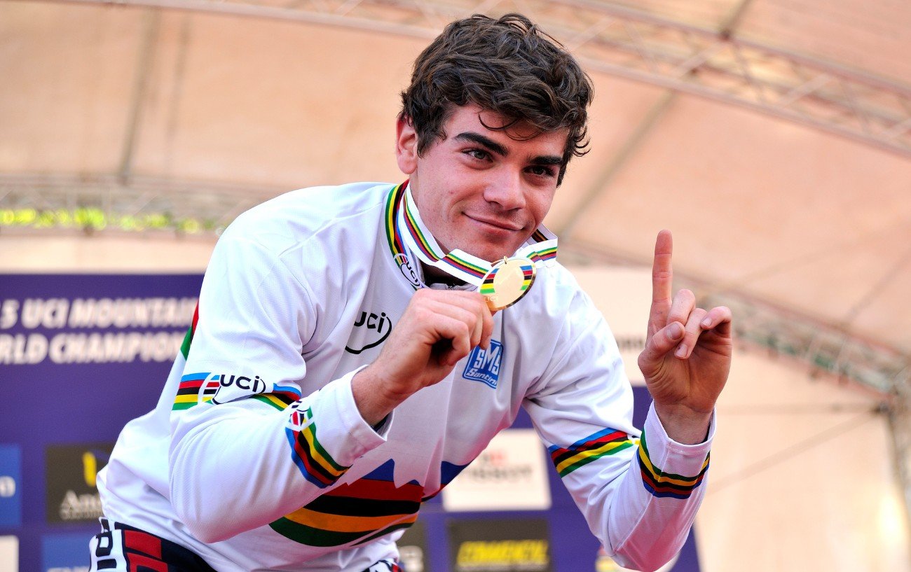 Loic Bruni holds his world championship medal on the podium.
