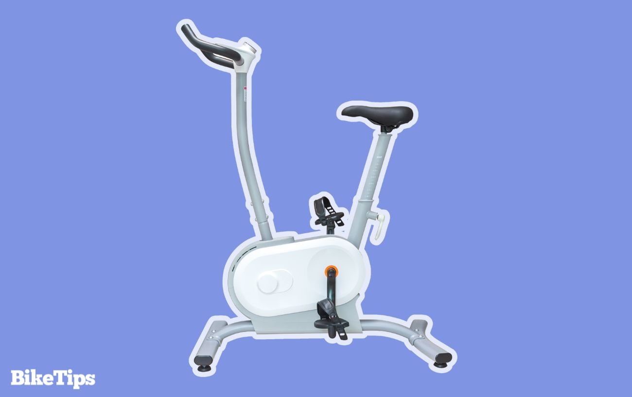 Upright exercise bike on a purple background.