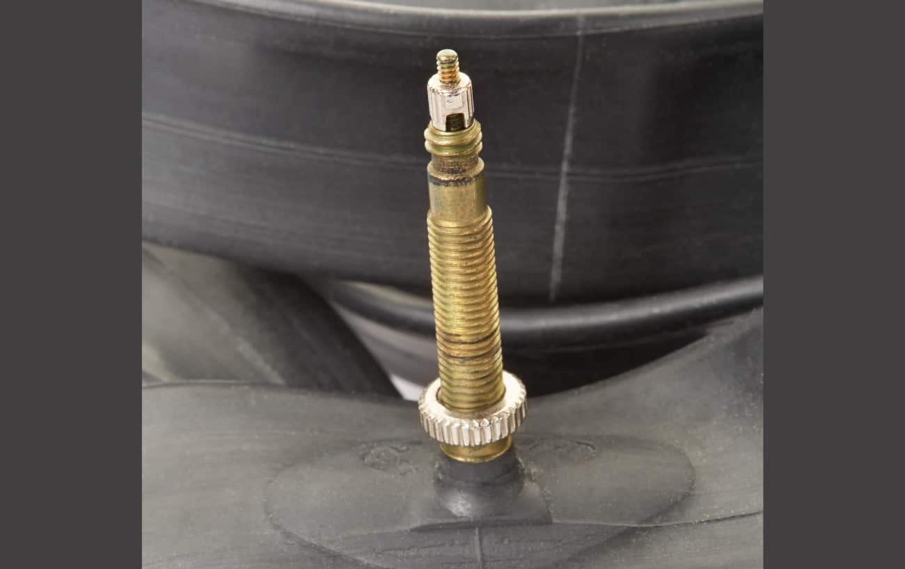 Presta valve, with the bicycle tire valve caps removed.