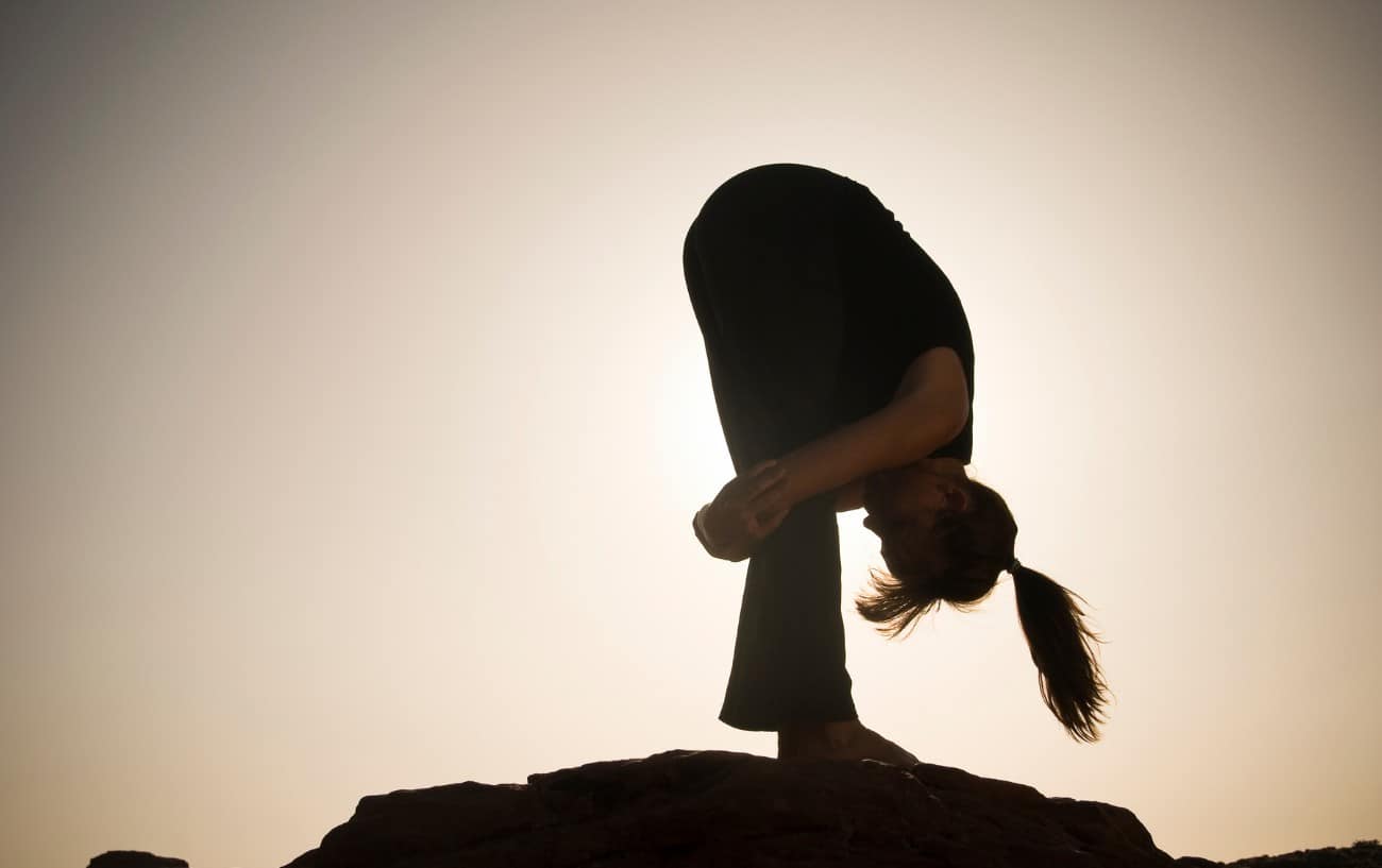 Standing Forward Bend (Uttanasana) with Crossed Legs