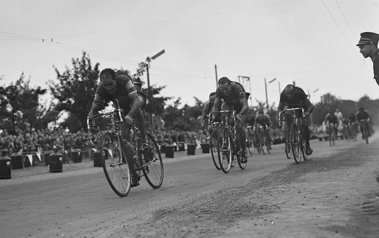 Gino Bartali, Hugo Koblet, and Fiorenzo Magni sprint for the finish line on Stage 2 of the 1953 Tour de France.
