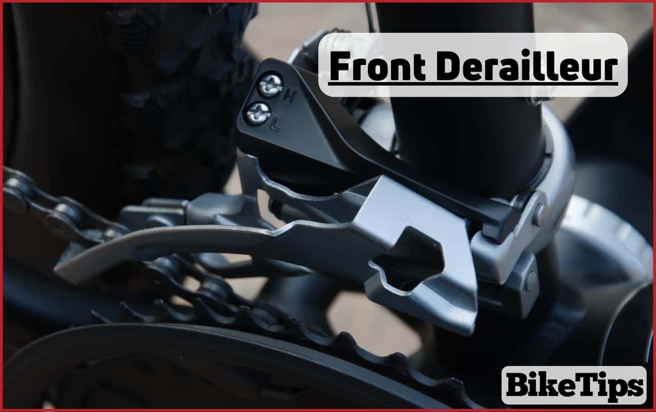 Close-up of a silver front derailleur on a black bike.