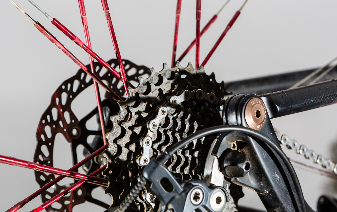 Close-up of a bike cassette on a black mountain bike.