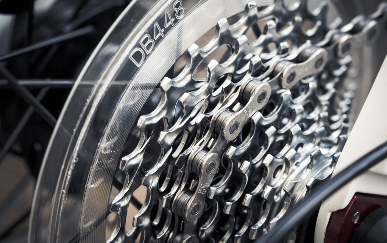 Close-up of a bike cassette on a white road bike.