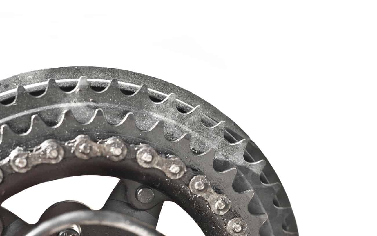 Close-up of a triple chainset with a white background.