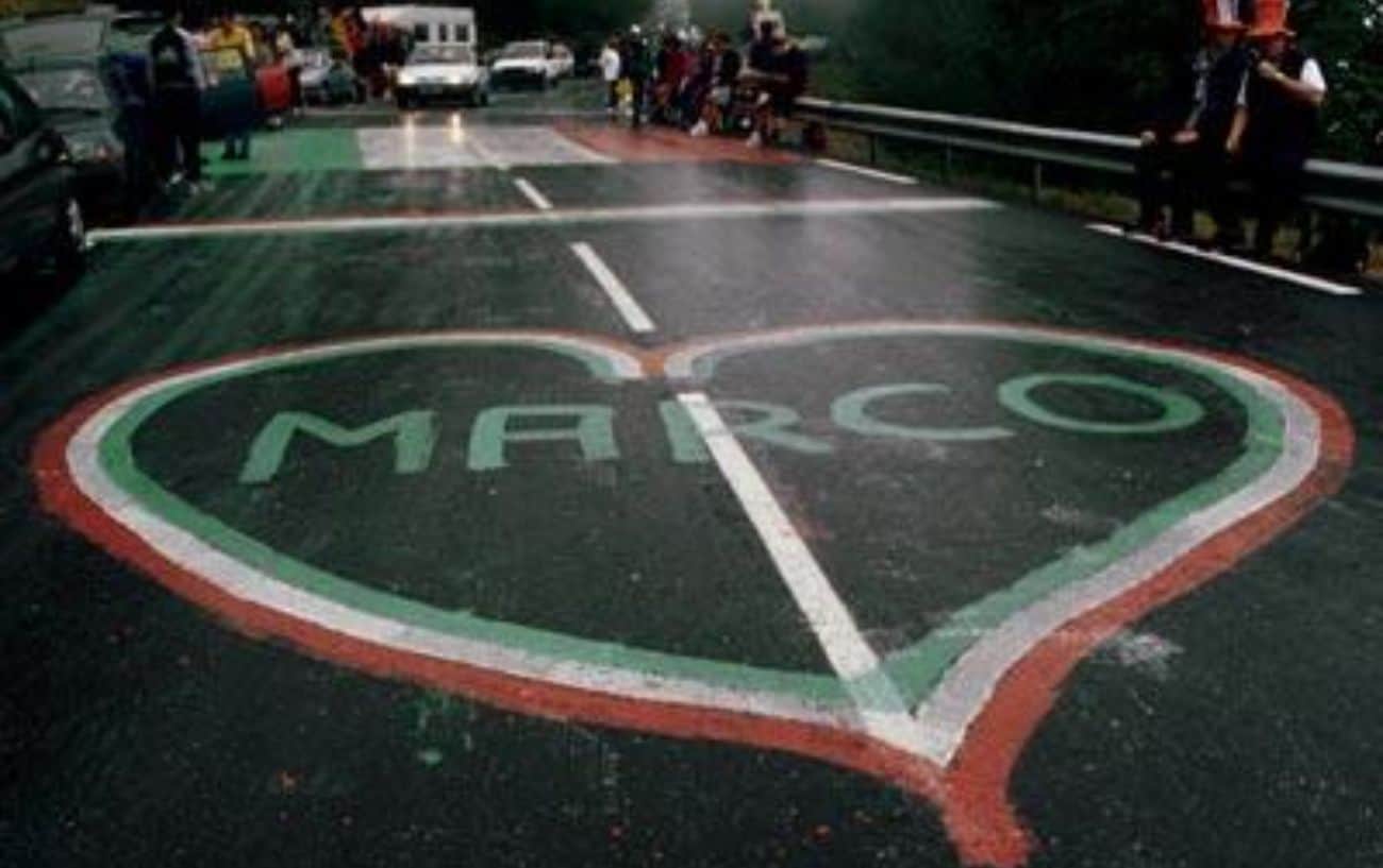 Marco Pantini's fans graffiti the road before the peloton's arrival to Les Deux Alpes during the 1998 Tour de France.