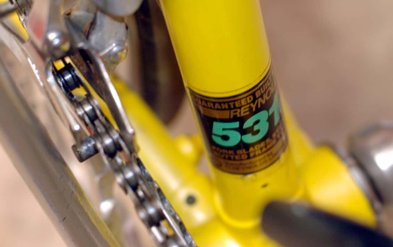 Close-up of a Reynolds 531 Steel decal on a yellow bike frame.