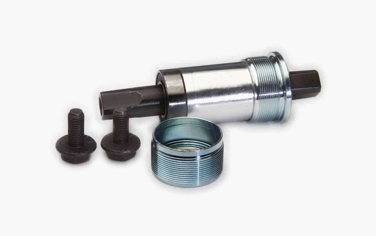 Photo of a disassembled bottom bracket on a white background.