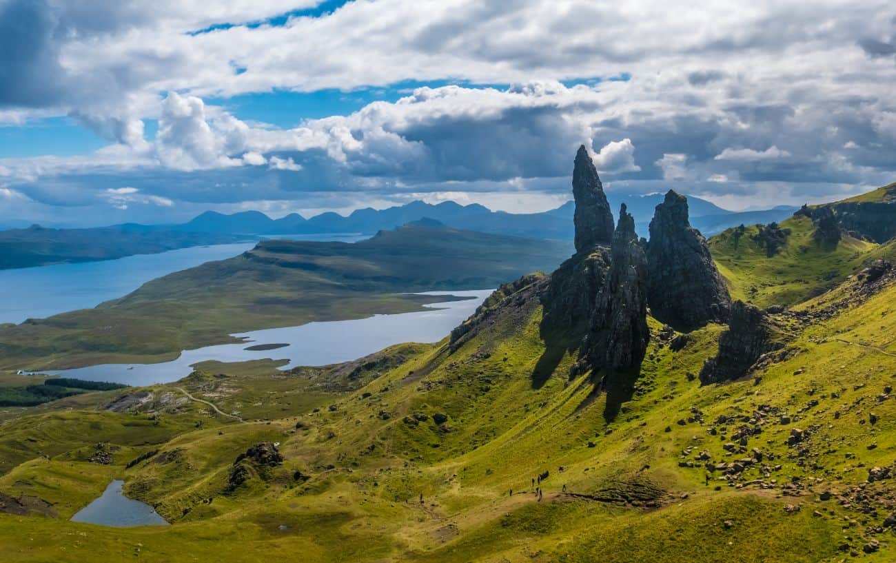 A dramatic, stormy, sunlit view of a mountain range in the Hebrides.