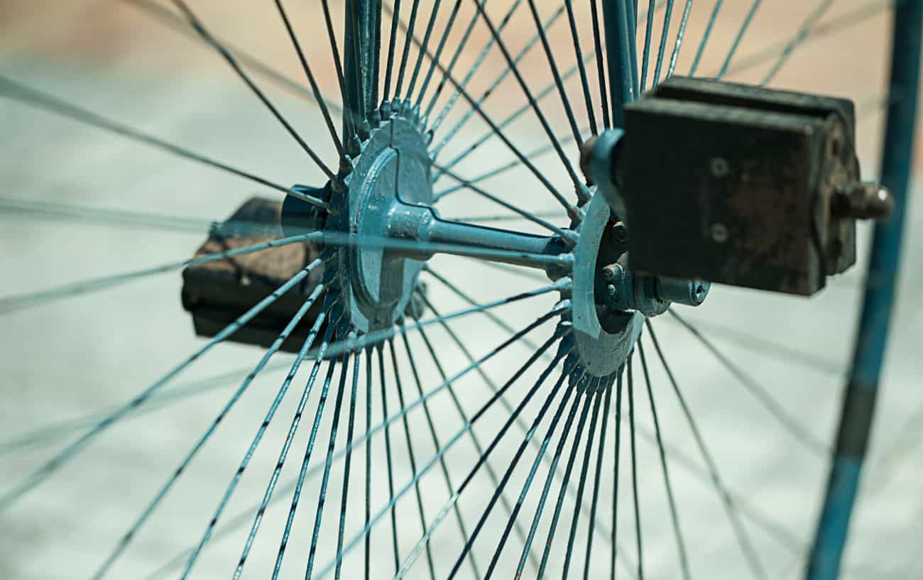 Close-up of the pedals on a penny farthing bicycle.