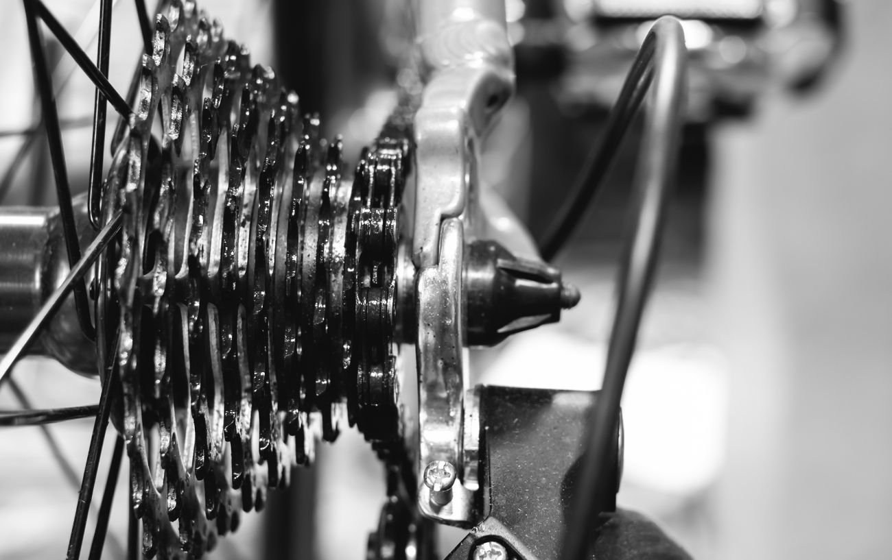 Black and white close-up of a bike cassette.