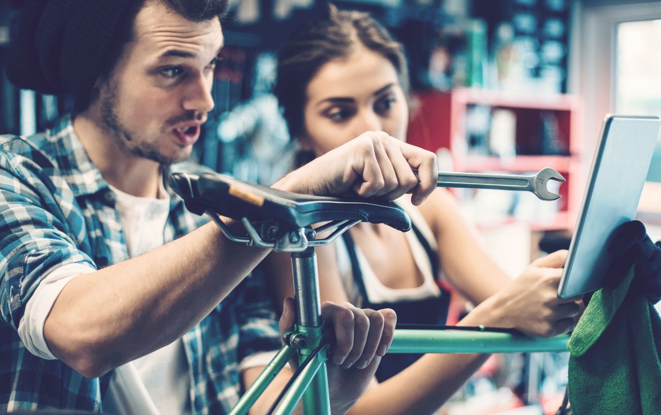A man checks the frame before buying a bike.