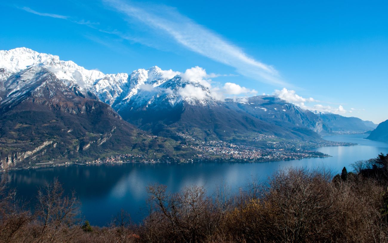 Snowcapped mountains overlooking Lake Como on a crisp autumn day.