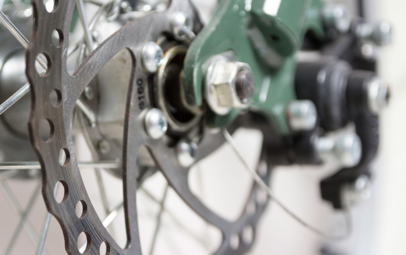 Close-up of a disc brake on a mountain bike.