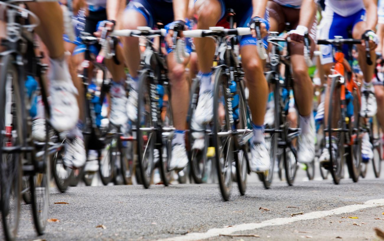 A pack of cyclists competing in a criterium.
