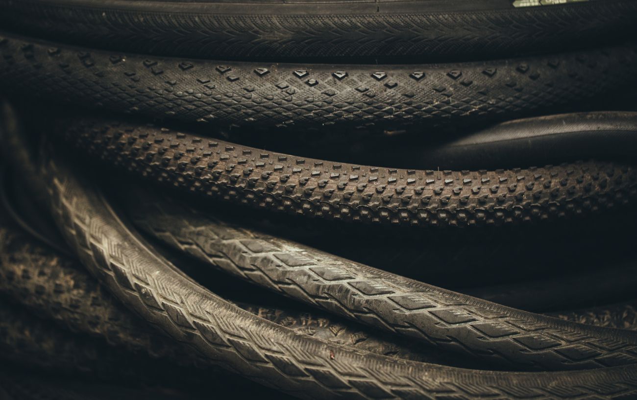 A pile of bike tires in a warehouse.