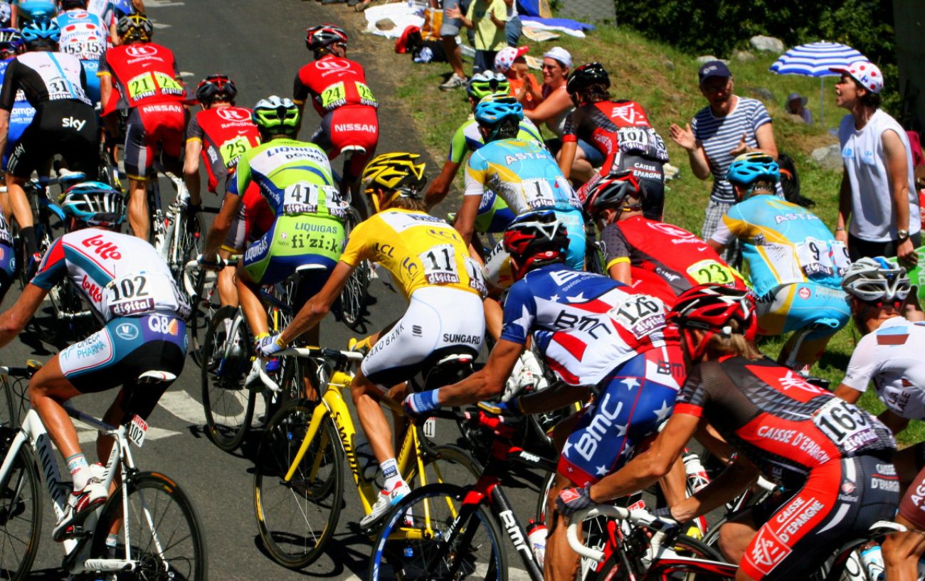 The peloton climb a mountain competing for the prize money for the Tour de France.