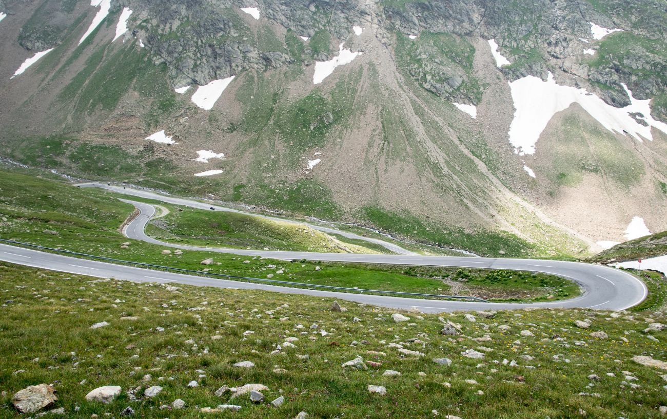 A road with switchbacks in the Alps.