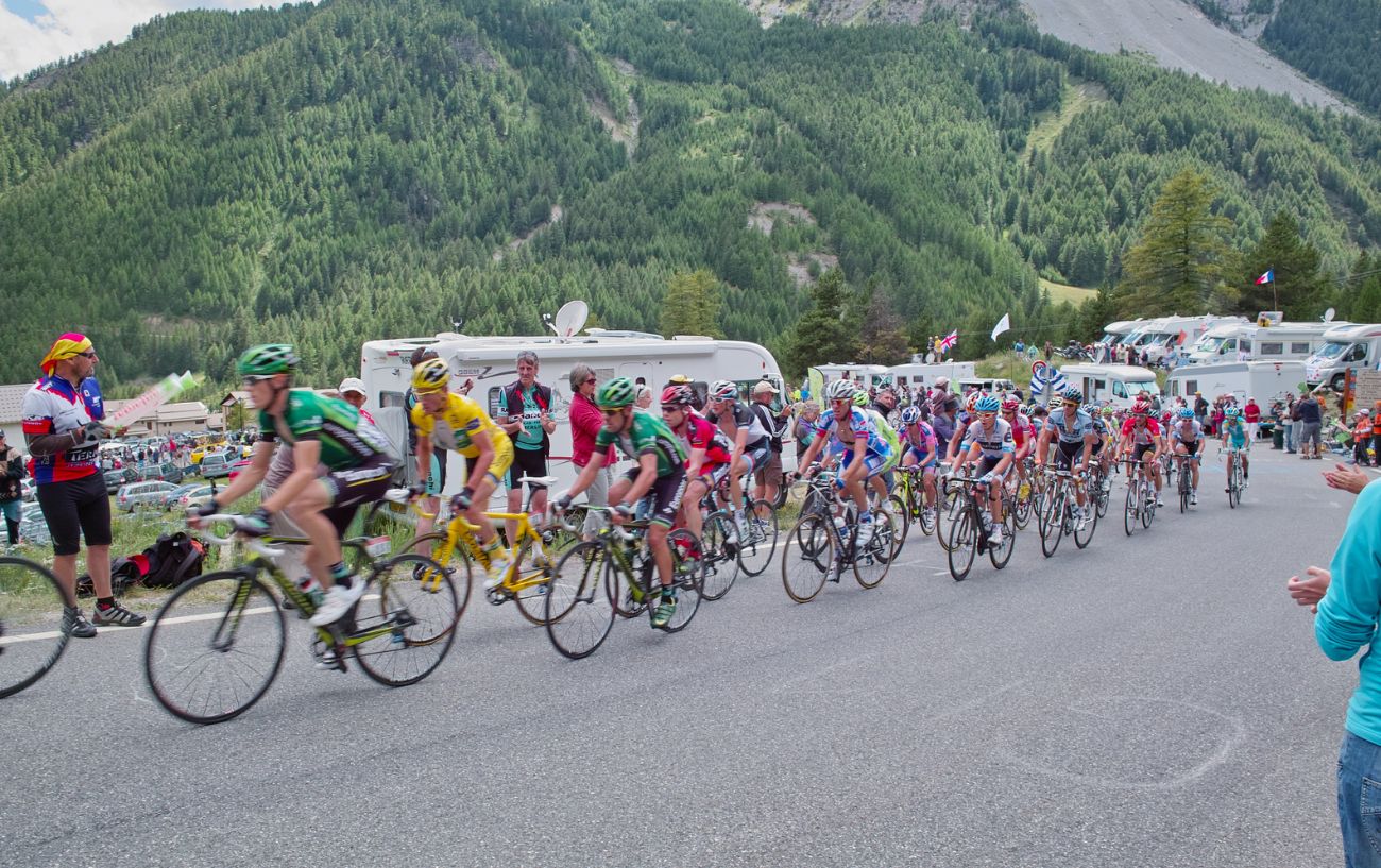 The peloton climbs a mountain at the Tour de France.