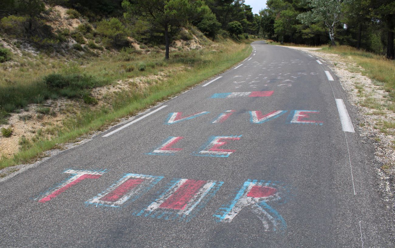 Fans' graffiti on the road of a Tour de France climb.