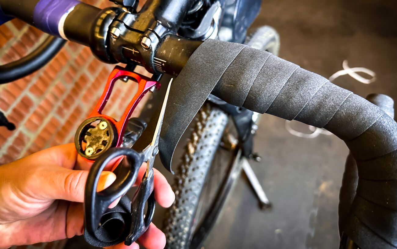 Cutting the end of the handlebar tape.