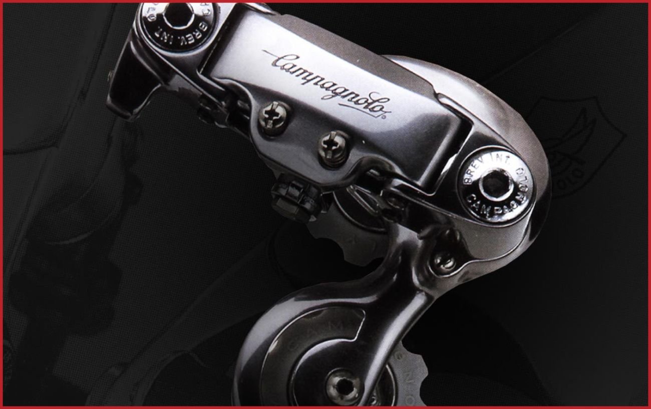 A Campagnolo derailleur from the 1980s on a black background.