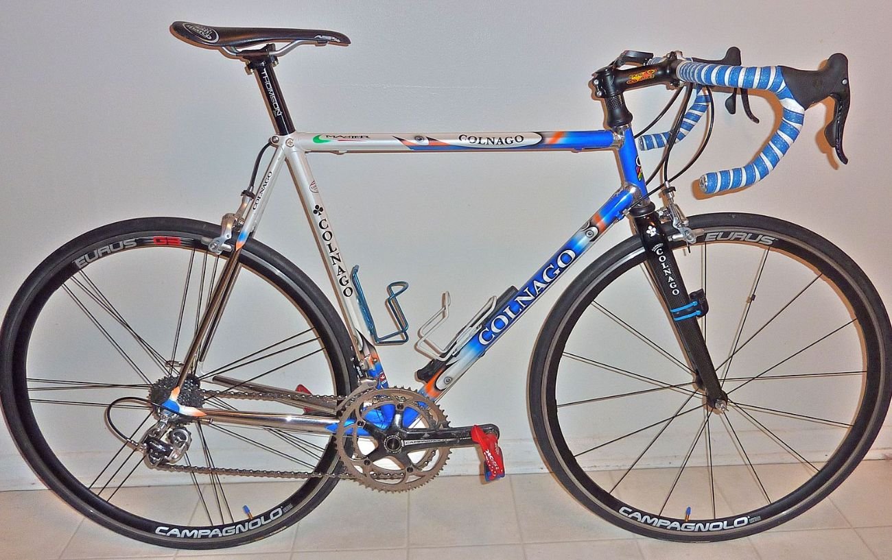 Colnago Master X-Light leaning against a white wall.