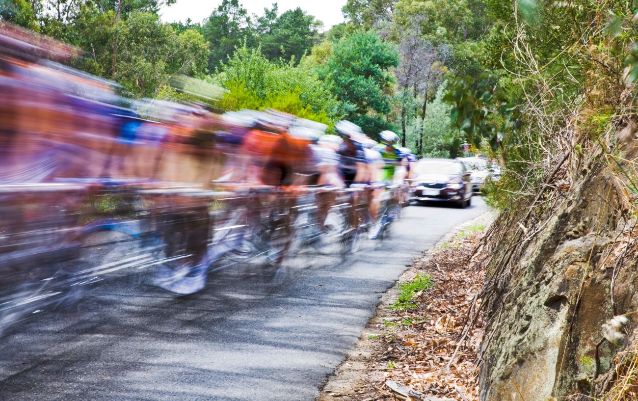 A Gran Fondo races through a hilly pass.