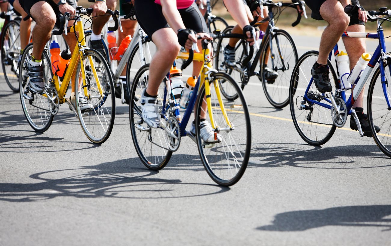 A group of cyclists ride together as part of a sportive.