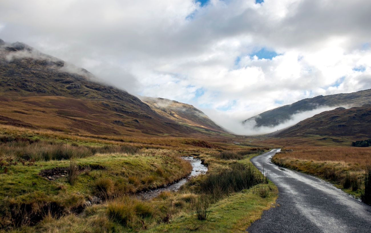 View across the valley with Hardknott Pass shrouded in mist.