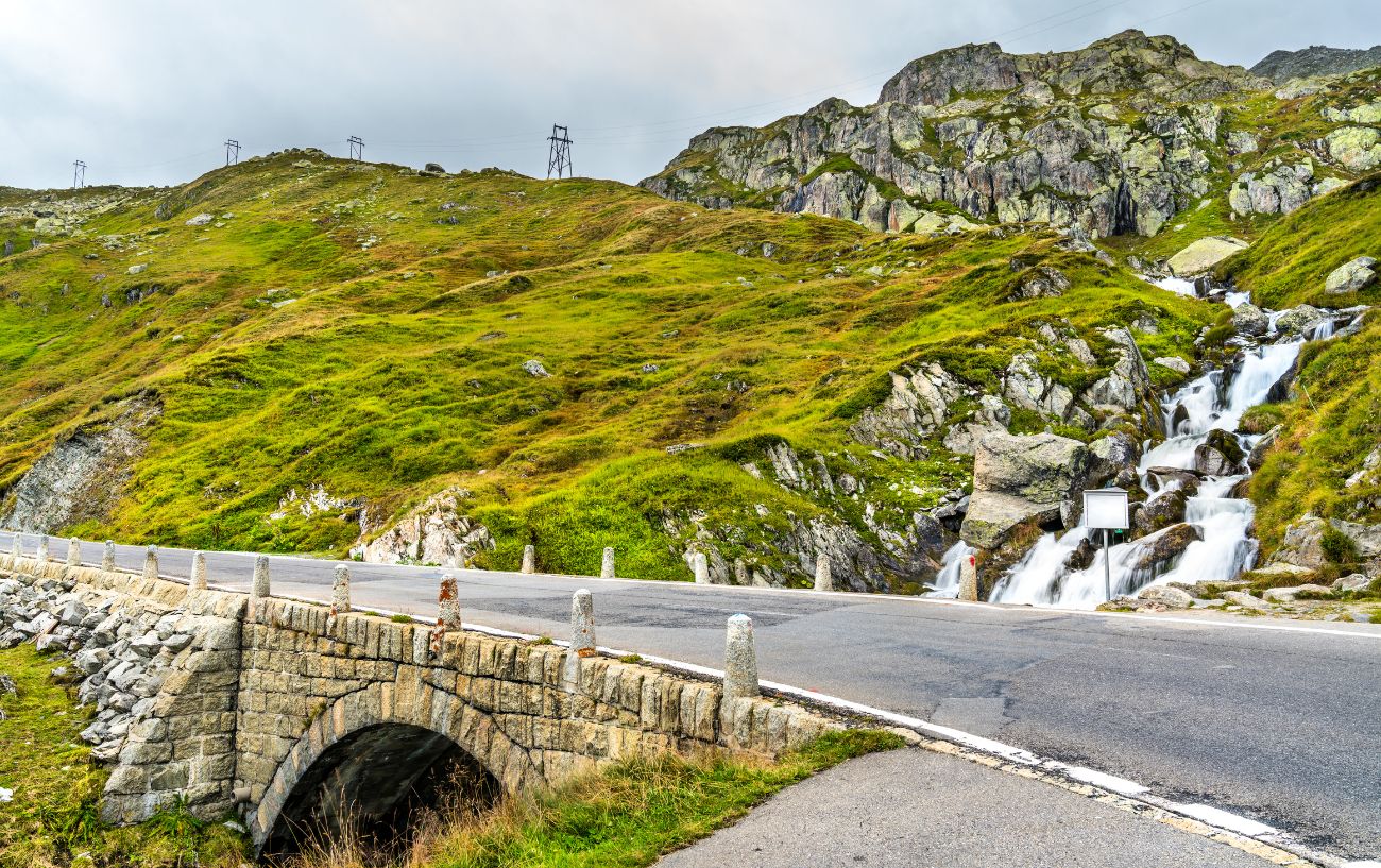 A small stone bridge over a waterfall on the Furka Pass.