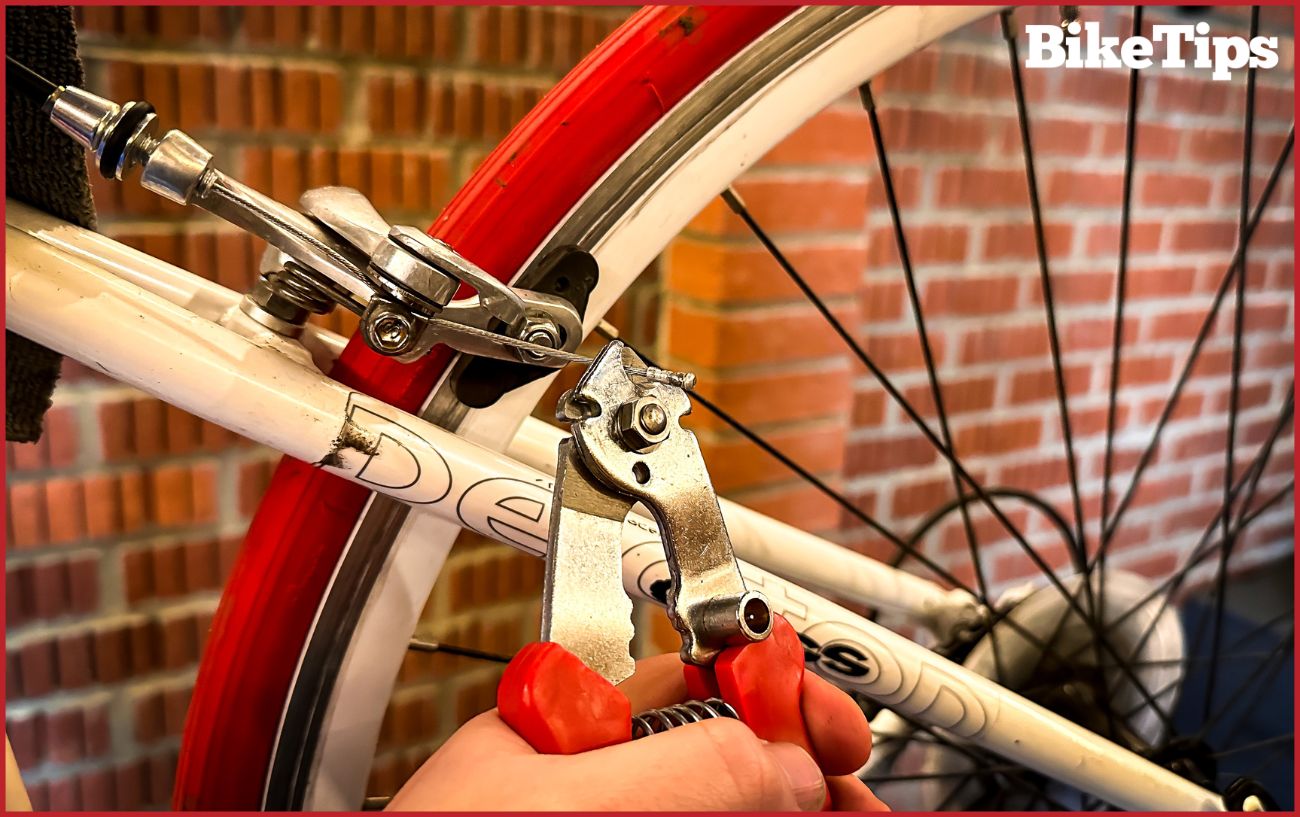 Cutting off the end cap from a brake cable.