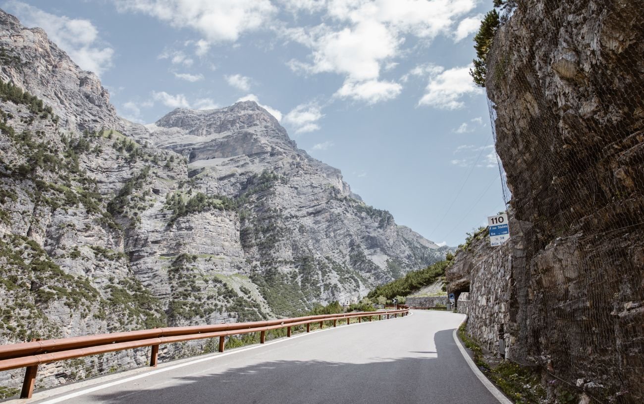 A road in a valley in the Dolomites.
