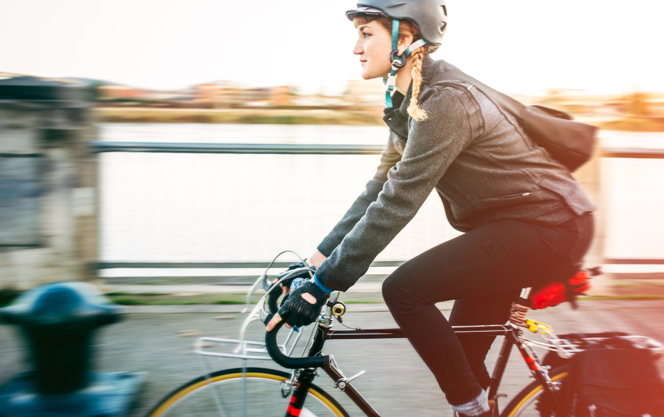 A cyclist commuting by bike.