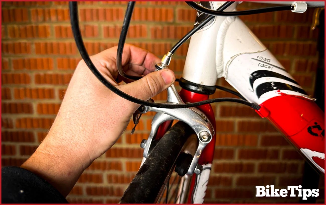 Making adjustments to the brake cable tension.