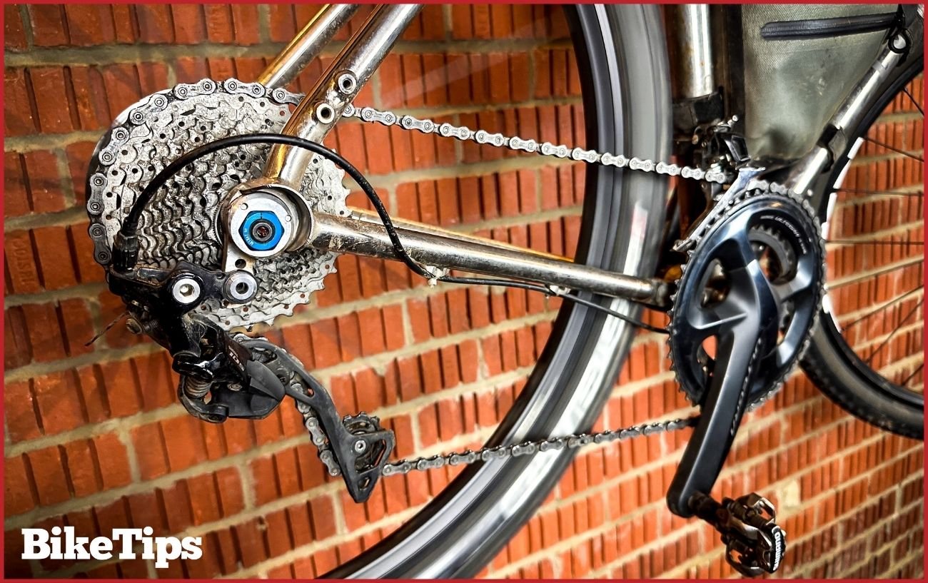 The bike's drivetrain in a "cross-chaining" position, with the chain on the largest chainring and the largest cassette sprocket.