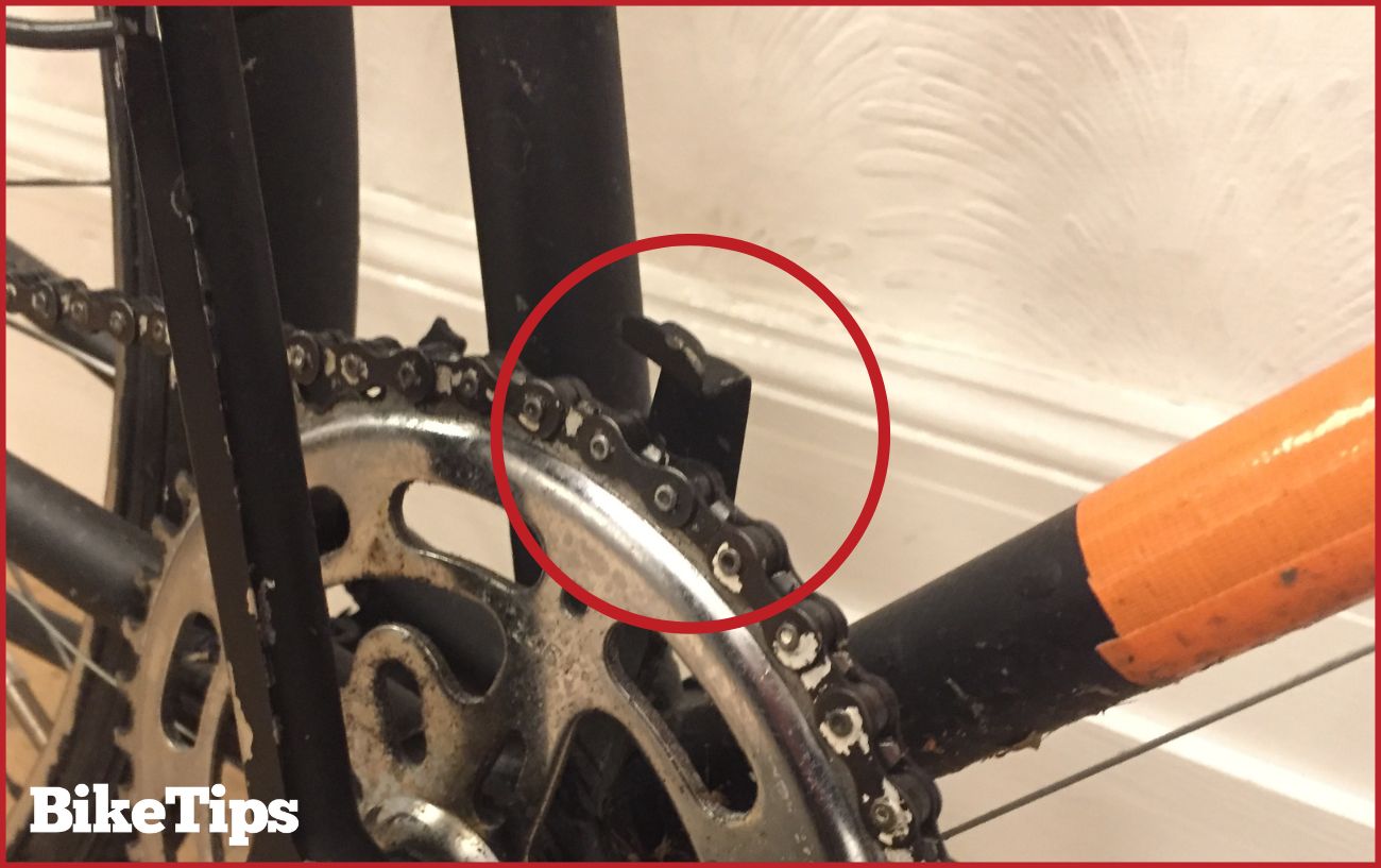 A black chain catcher on a city bike.