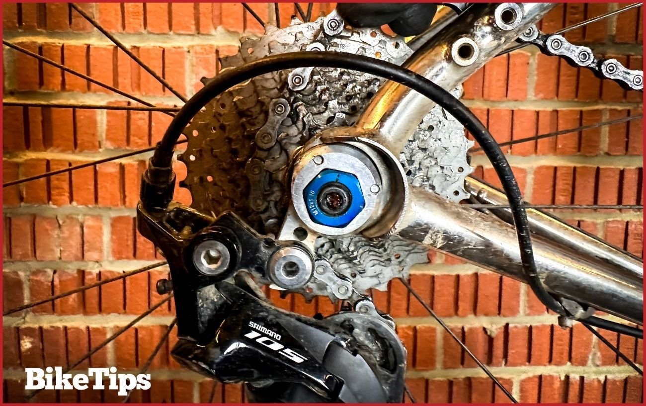 Lifting the chain away from the frame where it was trapped at the cassette.