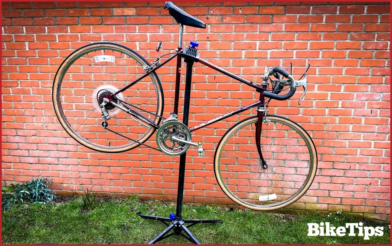 The bike sits in a stand after having the rust removed.