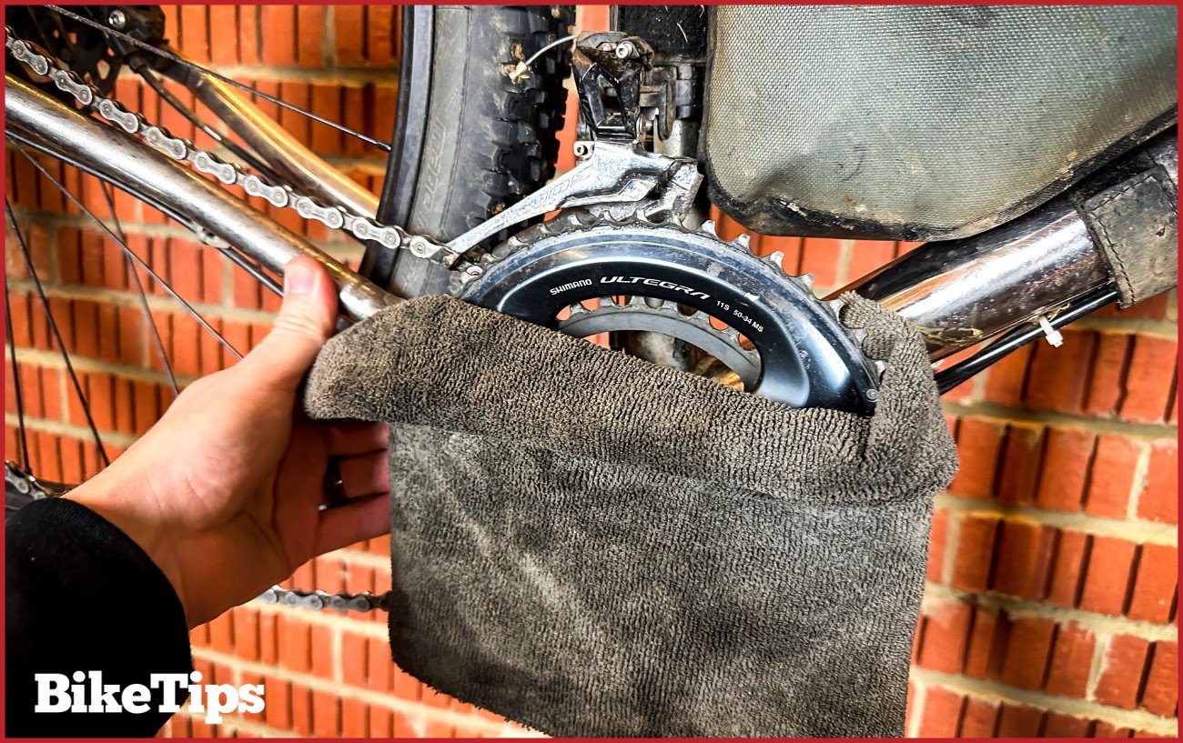 Using the rag to pell the crankset out of the bottom bracket.