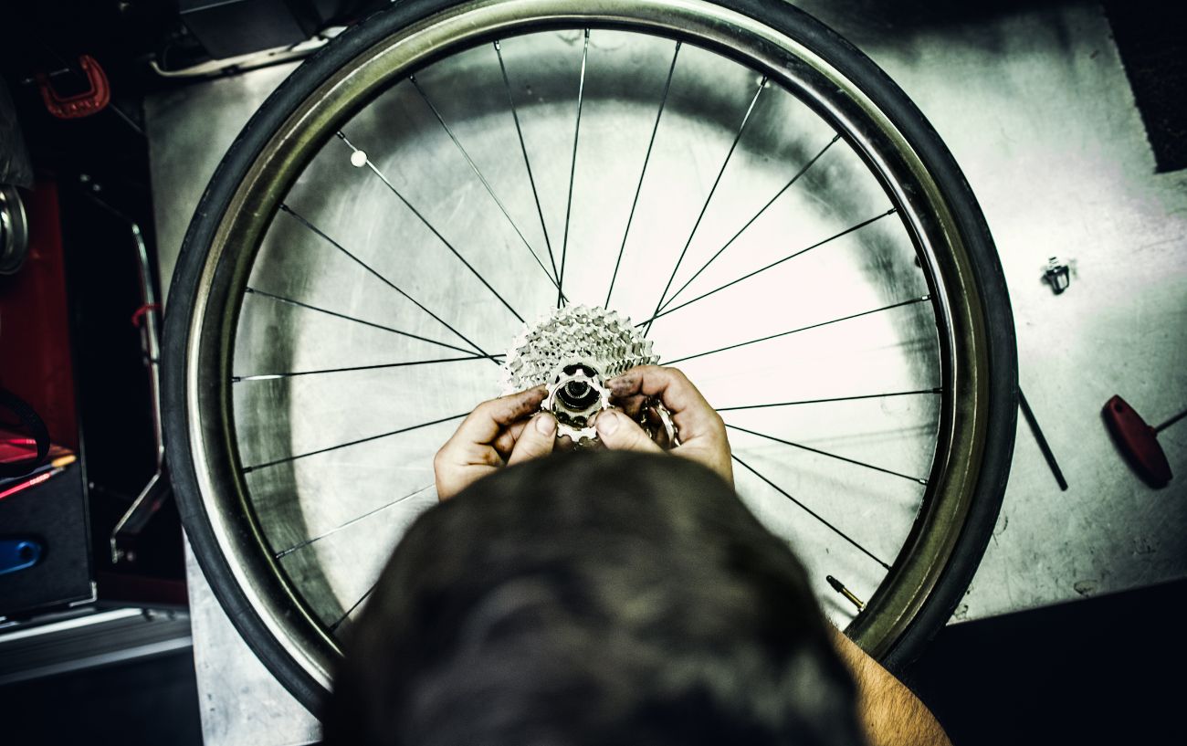 Assembling a cassette on a bike wheel.