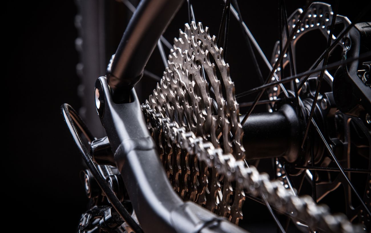 Close-up of a cassette on a black bike.