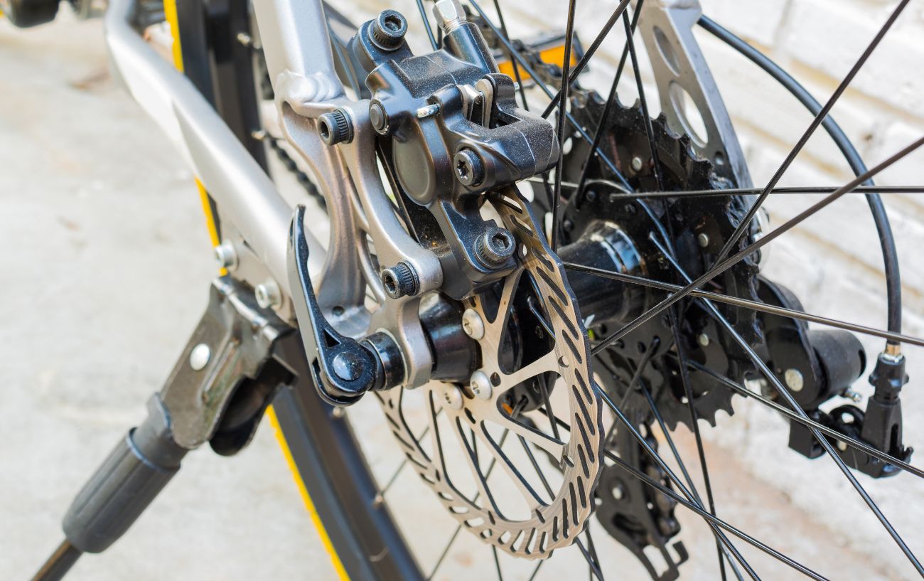 Powerful disc brakes on a silver mountain bike.