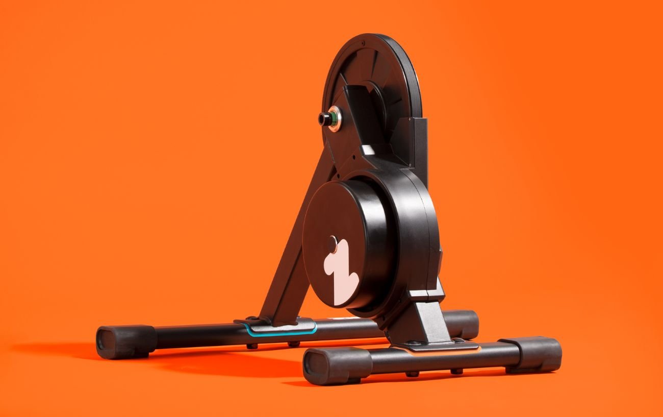 The Zwift Hub photographed against an orange background.