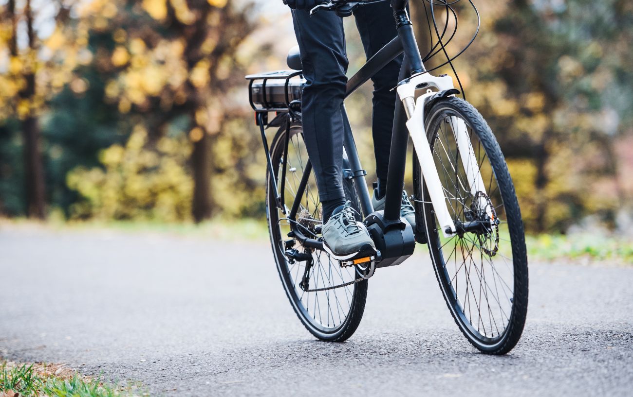 A cyclist on a black class 1 electric bike.