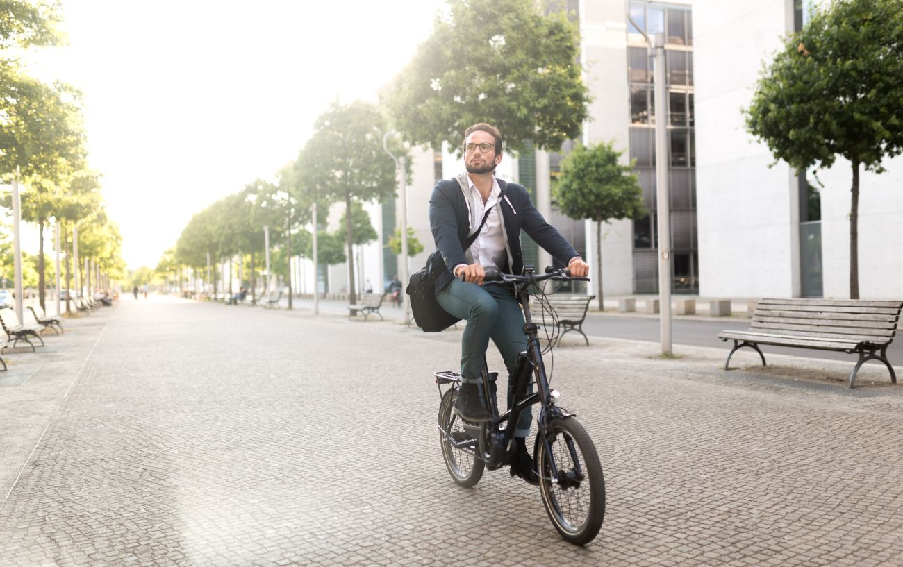 A cyclist rides one of the eBike classes in a city center.