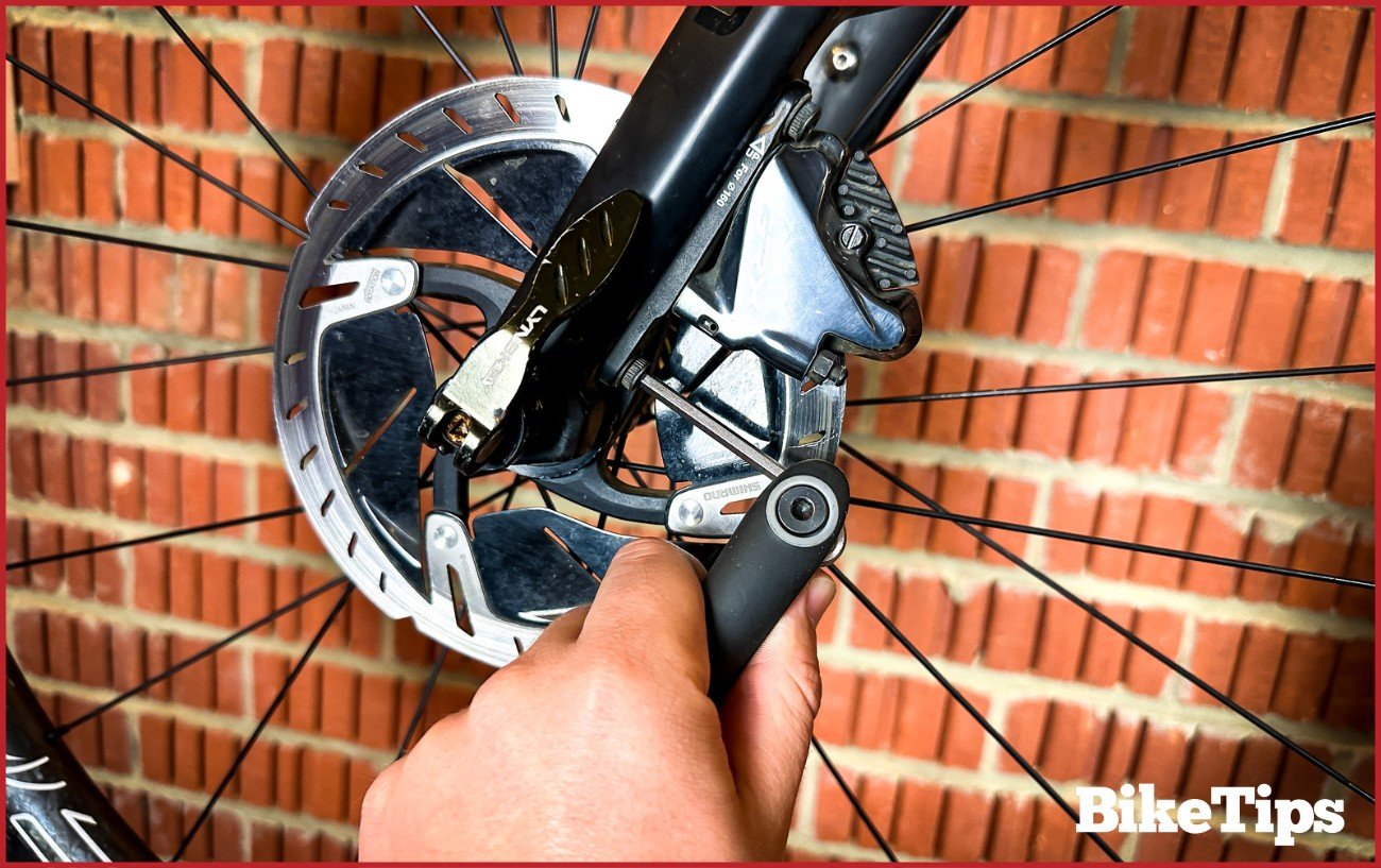 Aligning the caliper on a Shimano GRX hydraulic disc brake caliper. 