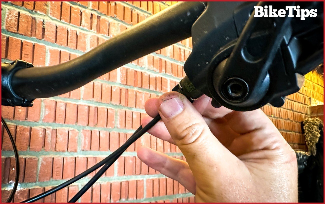 Adjusting the barrel of a mountain bike shifter made by SRAM.