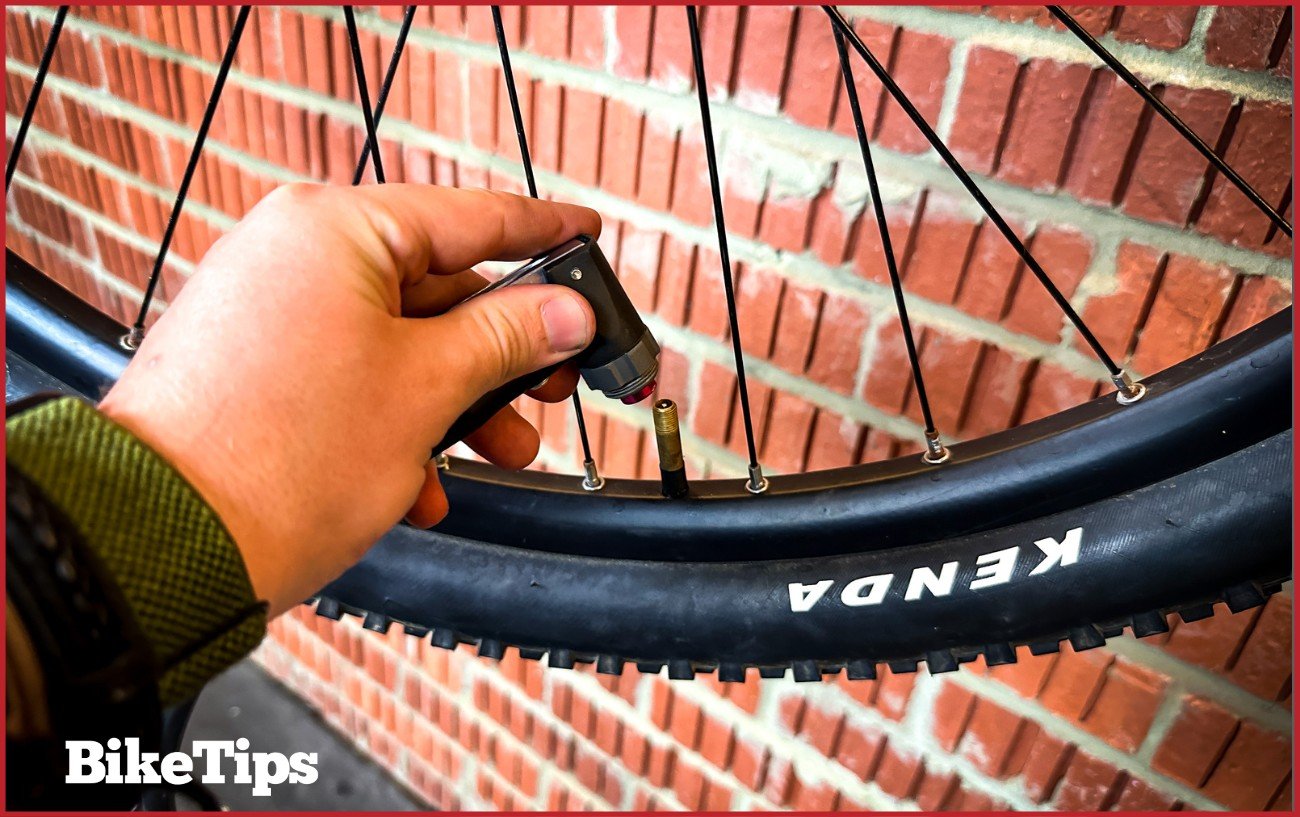 Putting a pump onto a Schrader valve.